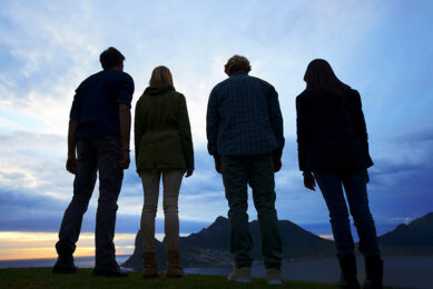 group of young adults watching the sunset