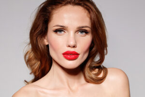 Studio portrait of beautiful female model with red lips
