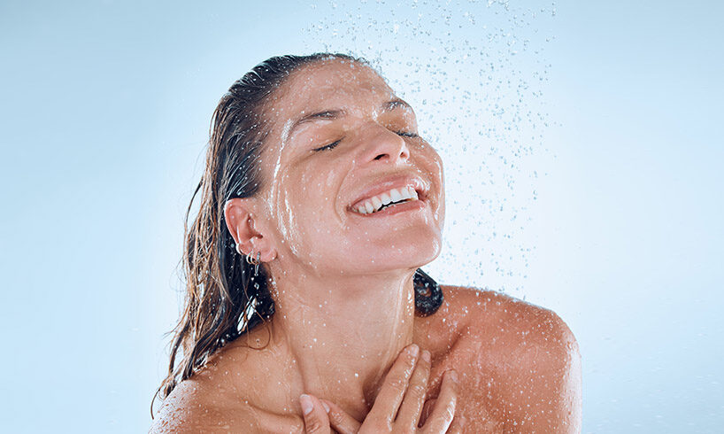young woman taking a shower