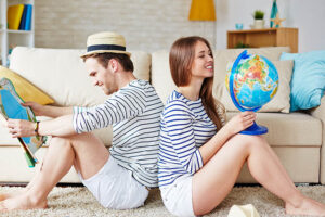 Young couple thinking of where to go traveling